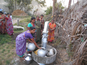 Women pumping the water from the well.jpg